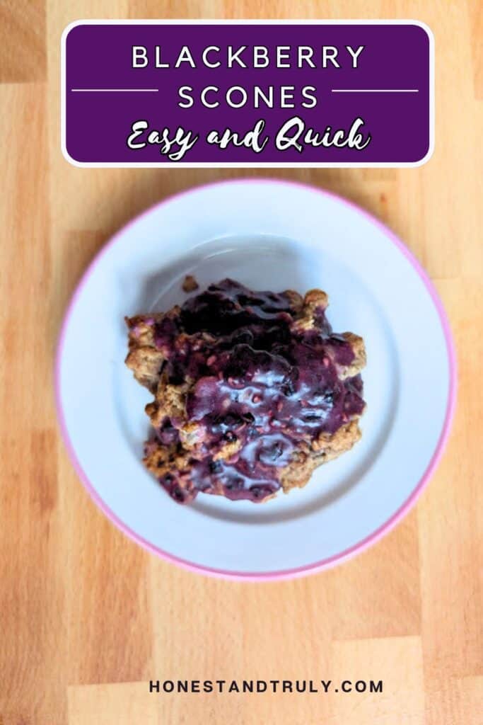 A plate with blackberry scones topped with purple glaze sits on a wooden surface. A text overlay reads "Blackberry Scones Easy and Quick.