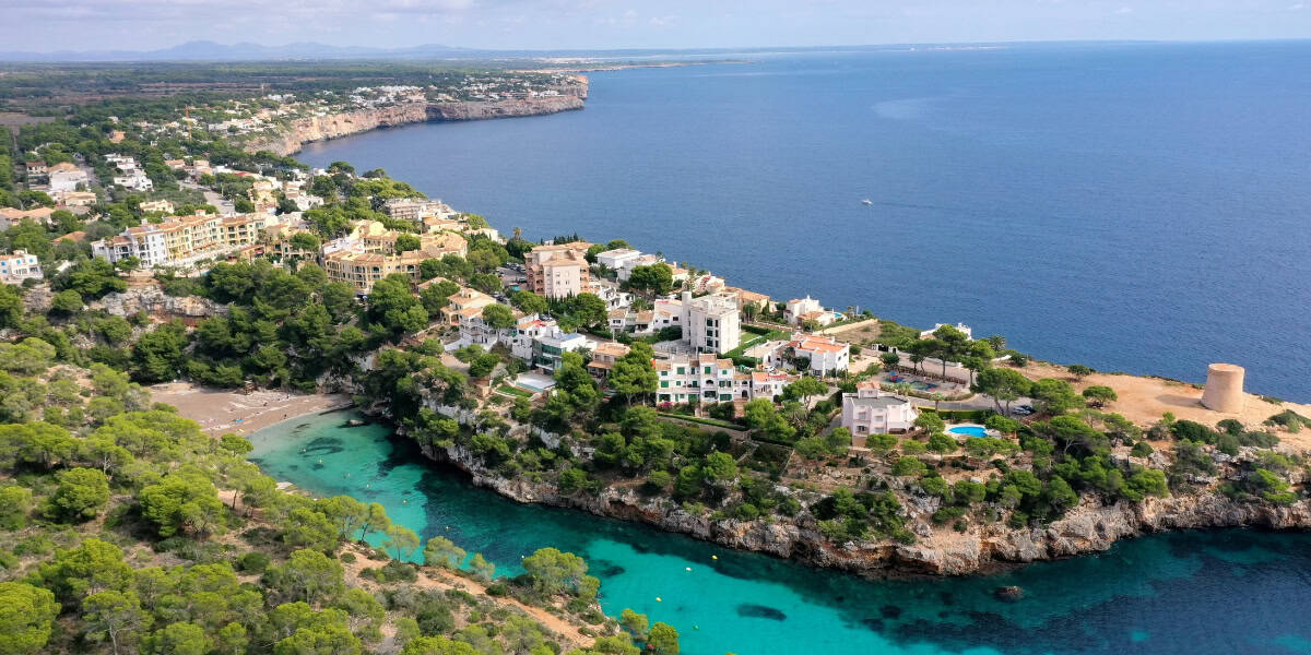 coastal-cove-houses-cliffs-aerial-view