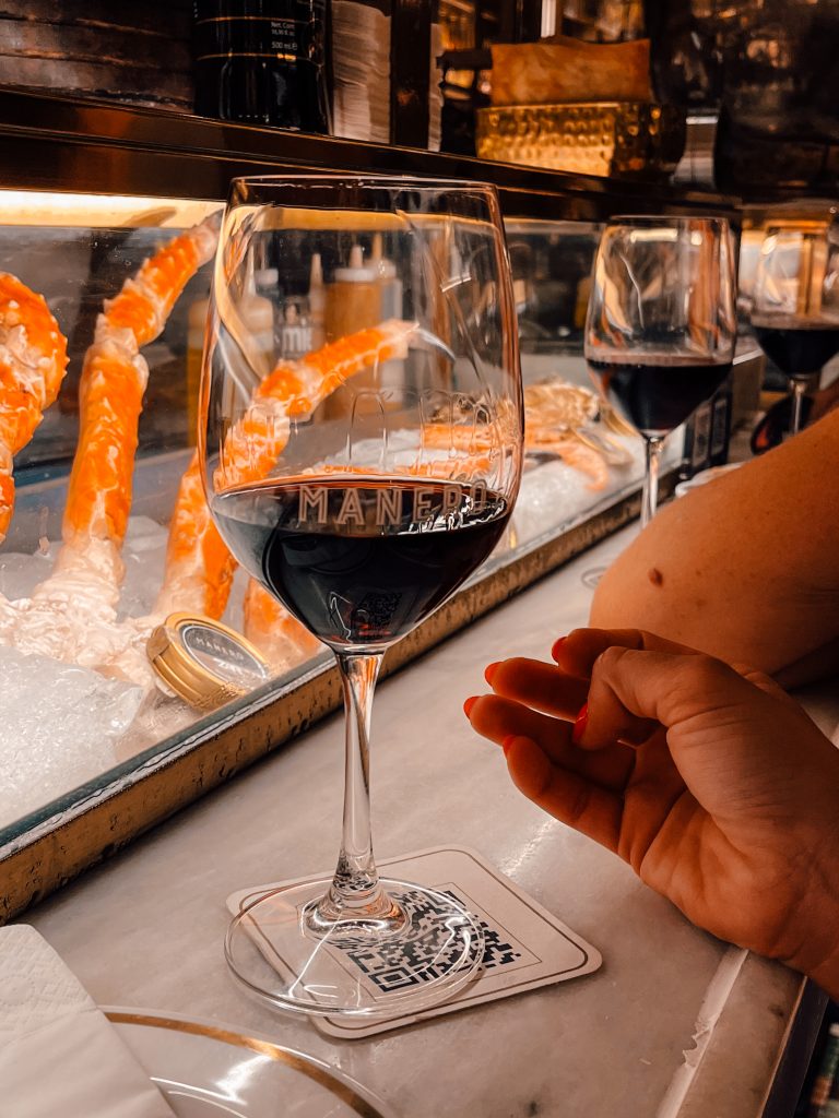 Red wines on the marble bar at Manero in Alicante