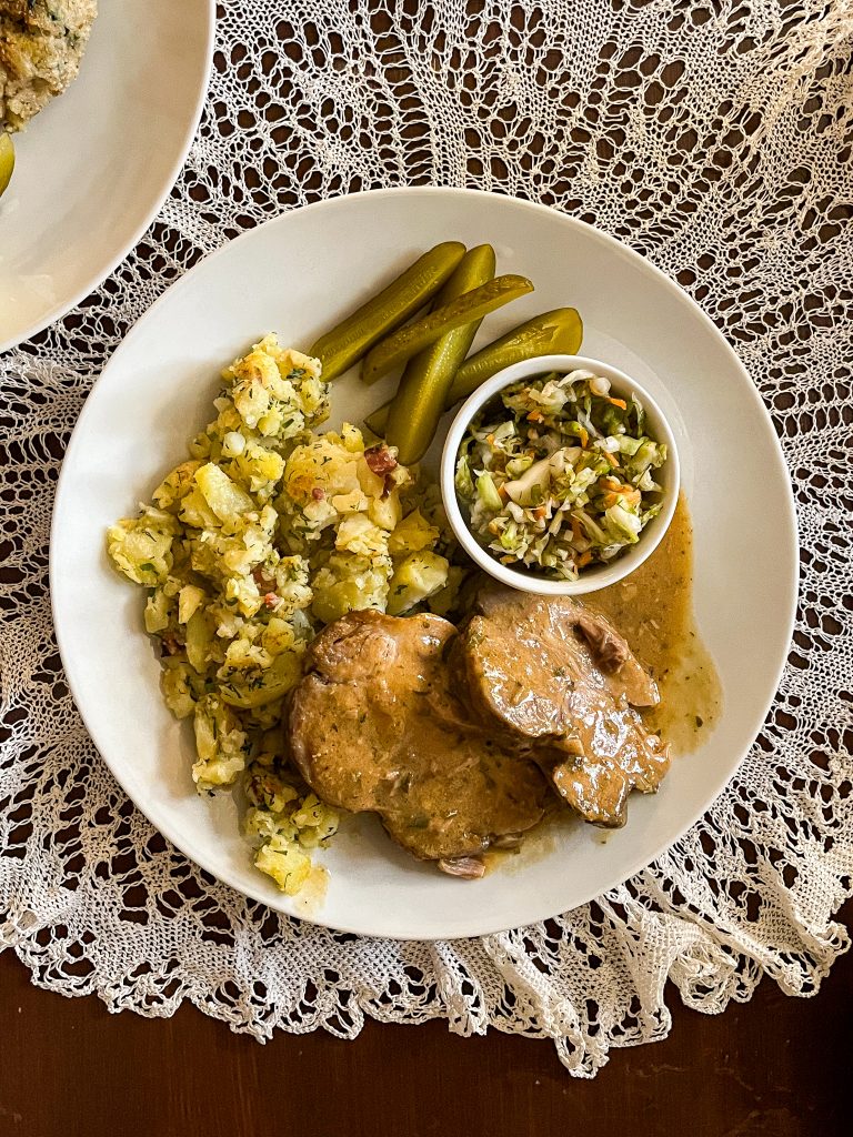 A plate of meat and potatoes.