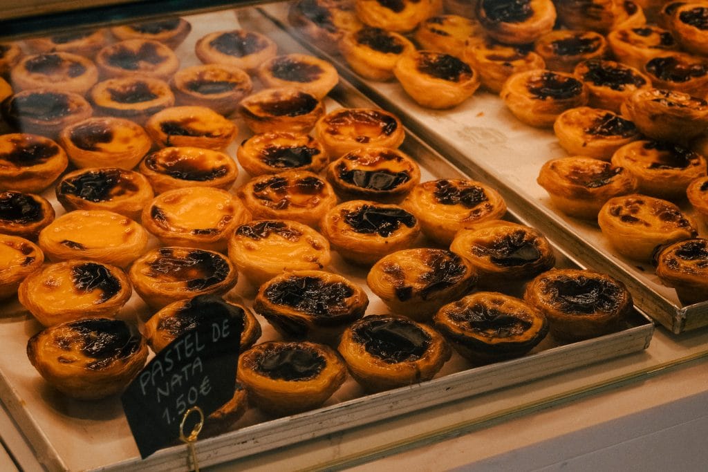 A tray of the best pastel de nata custard tarts in Lisbon.