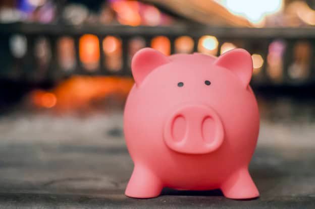Savings concept. Piggy bank with fireplace. Energy saving concep