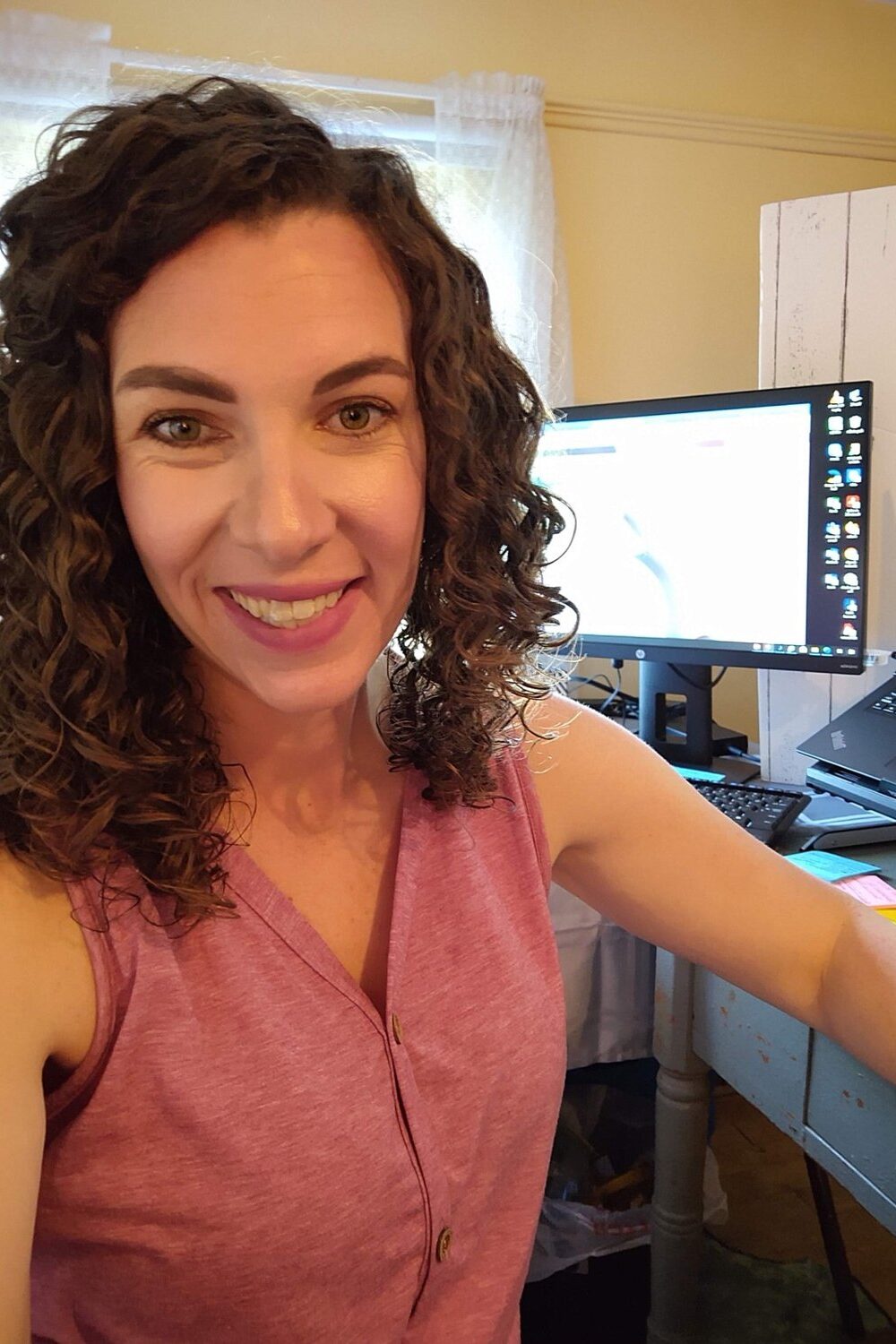 Jenn Adams at her desk planning how to homeschool in Pennsylvania