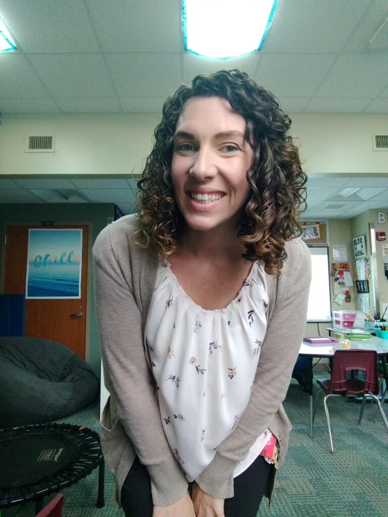 Jenn Adams in her classroom, living out the JAES mission