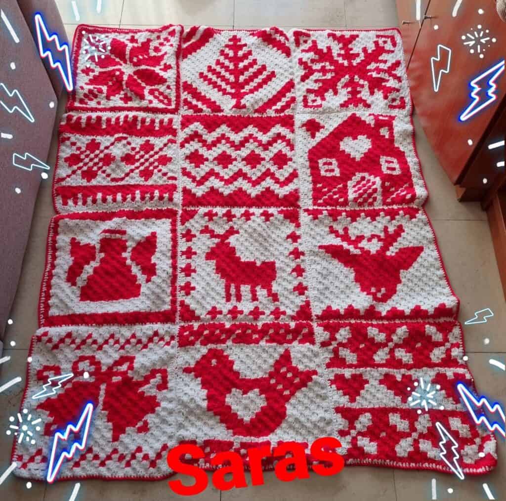 Nordic Winter Afghan crochet blanket with red and white Christmas motifs.