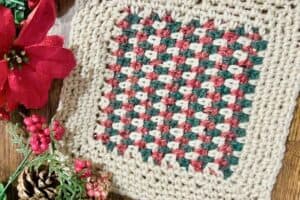 Crochet blanket with a colorful heart design, perfect for cozy home decor or gifting.