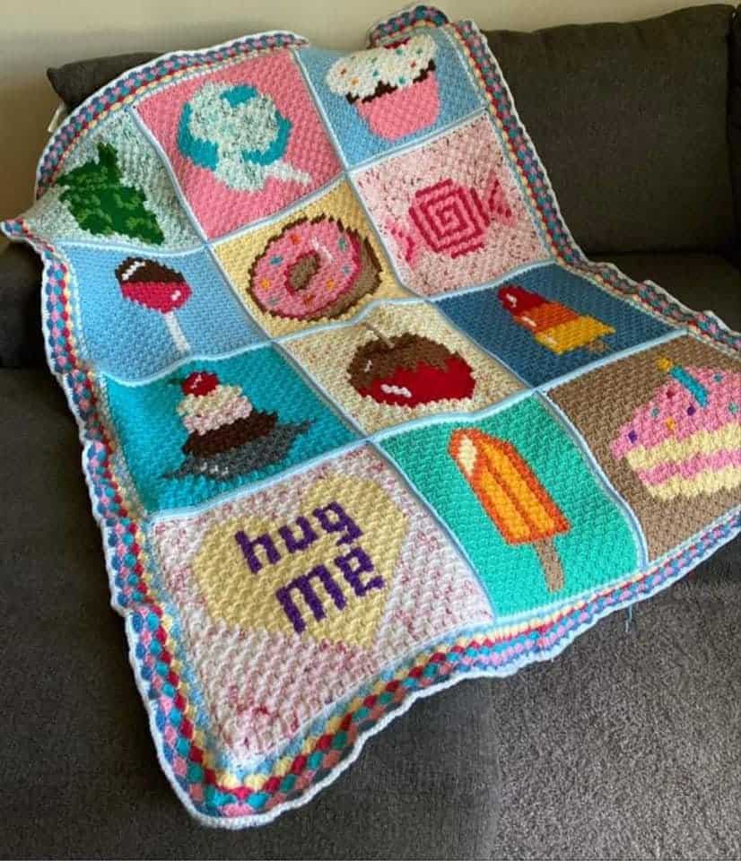 Autumn leaf crochet pillow with colorful cupcake and ice cream motifs, perfect for fall home decor.
