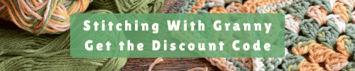 Decorative cabled granny pillow made with Bernat Blanket Yarn. Perfect for cozy home decor.