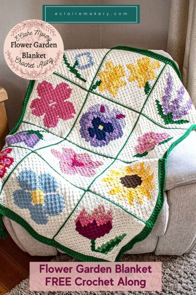 Colorful flower crochet blanket with vibrant floral motifs and green border. Perfect for cozy home d.