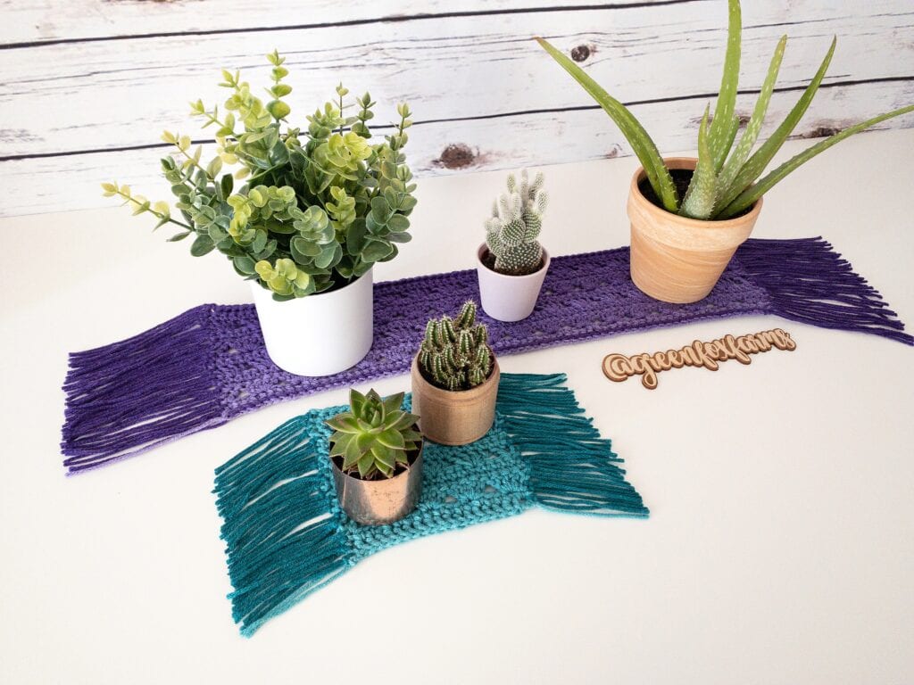 Handmade crochet plant mats with succulents and cacti for home decor.