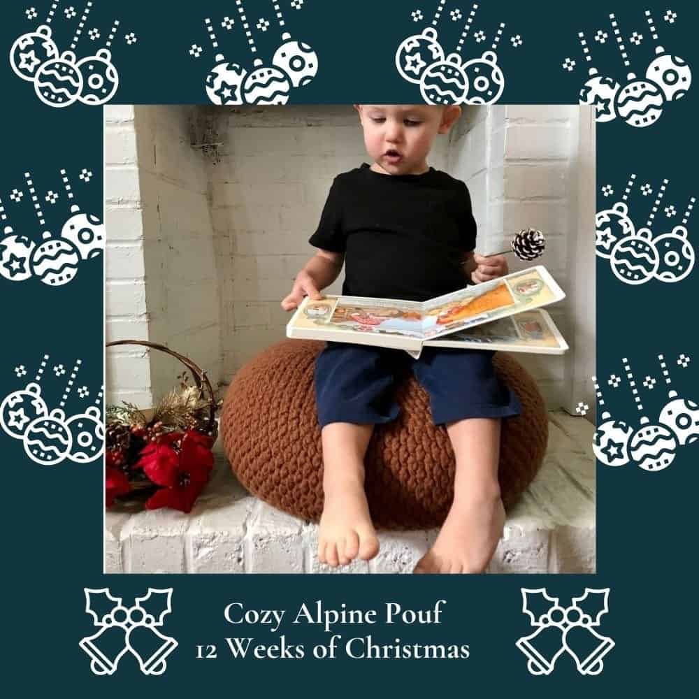 Child sitting on a brown knitted pouf, reading a book, in a festive Christmas setting.