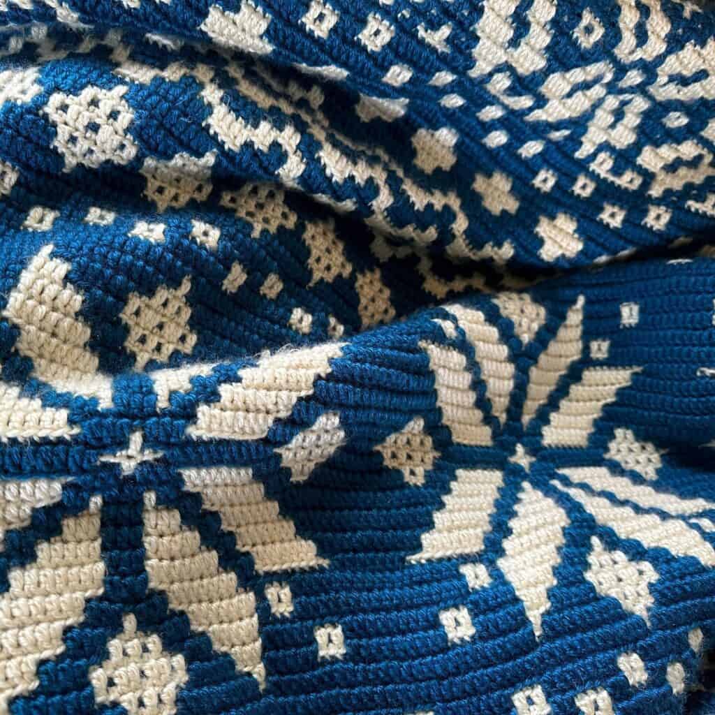 Cozy blue and white snowflake knit blanket from Juniper and Oakes.