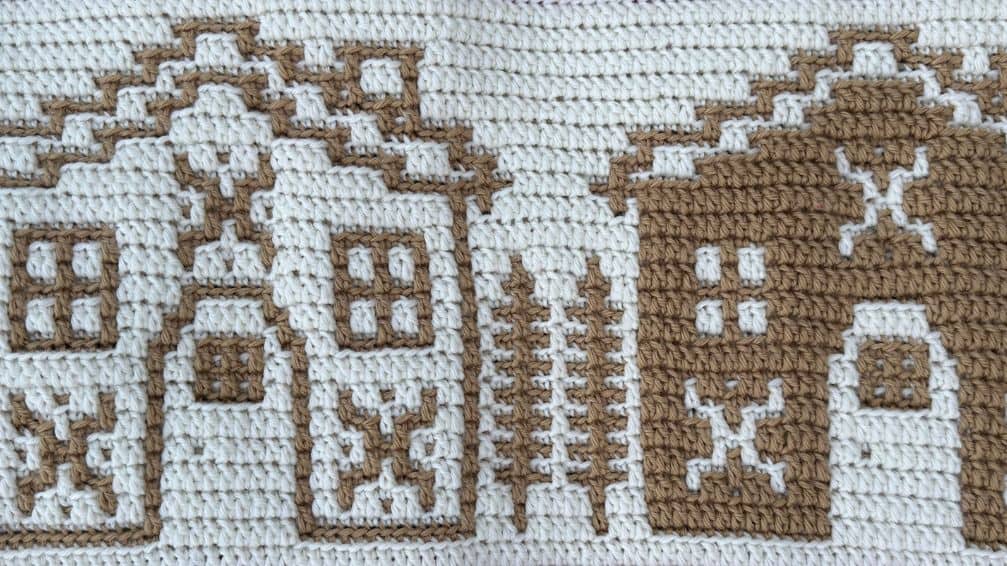 Crocheted gingerbread houses with detailed patterns for crochet along projects.
