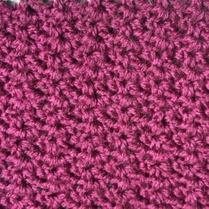 Pink crochet wattle stitch fabric for lace projects and tutorials.
