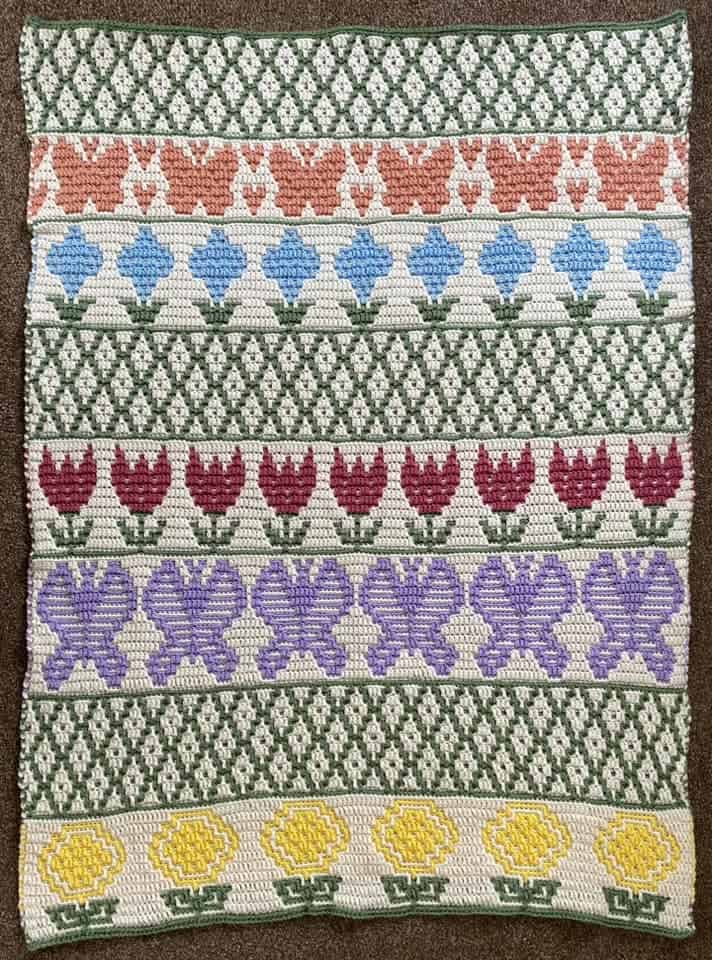 Stitch floral pattern with colorful tulips and geometric designs.