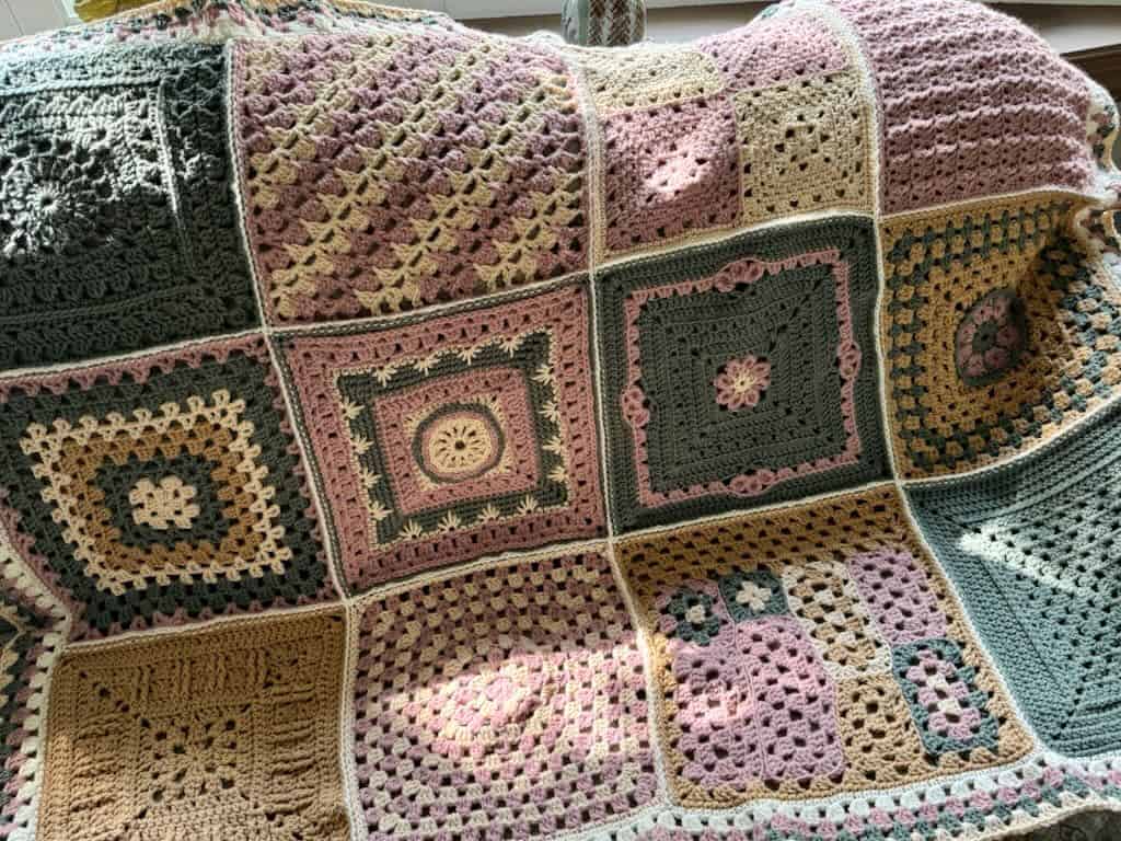 Vintage crochet heart granny square blanket for cozy home decor.