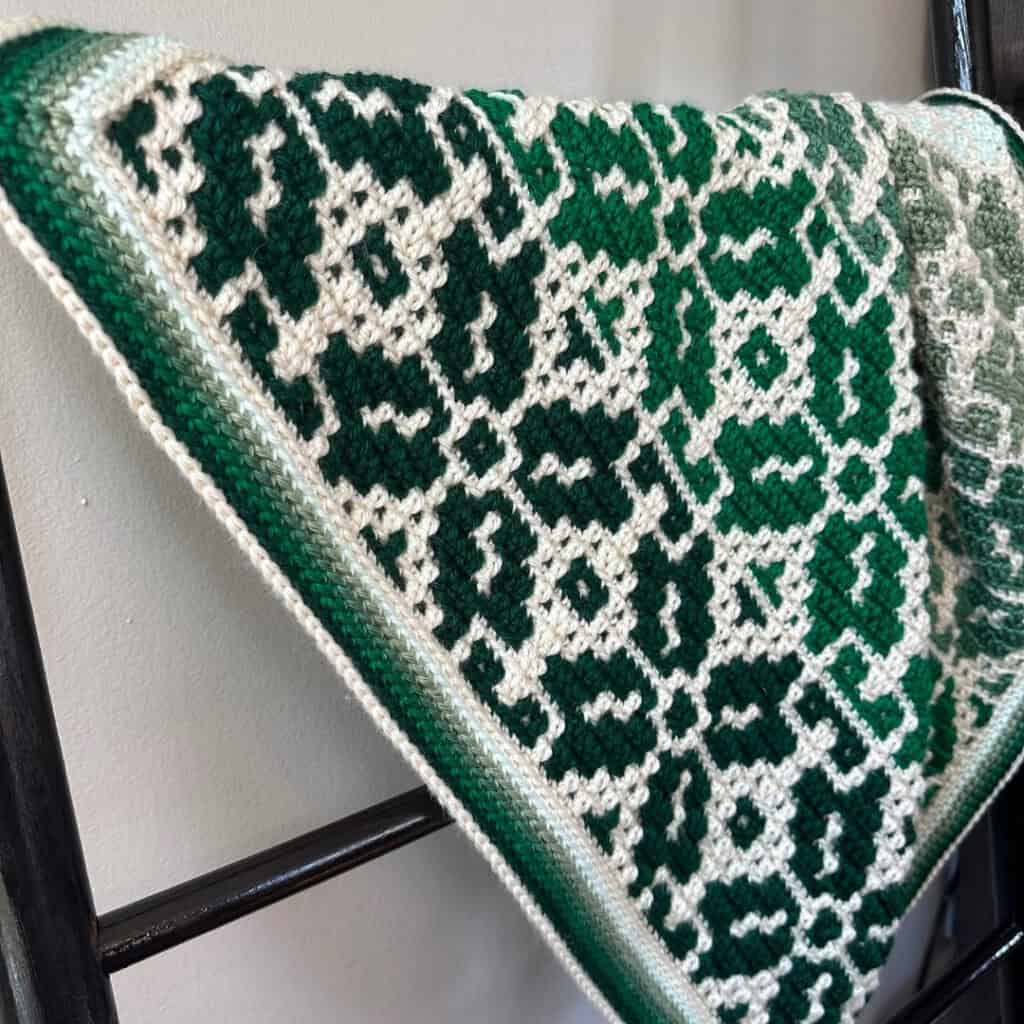 Beautiful green and white mosaic crochet Nordic star baby blanket. Perfect for nurseries and handmad.