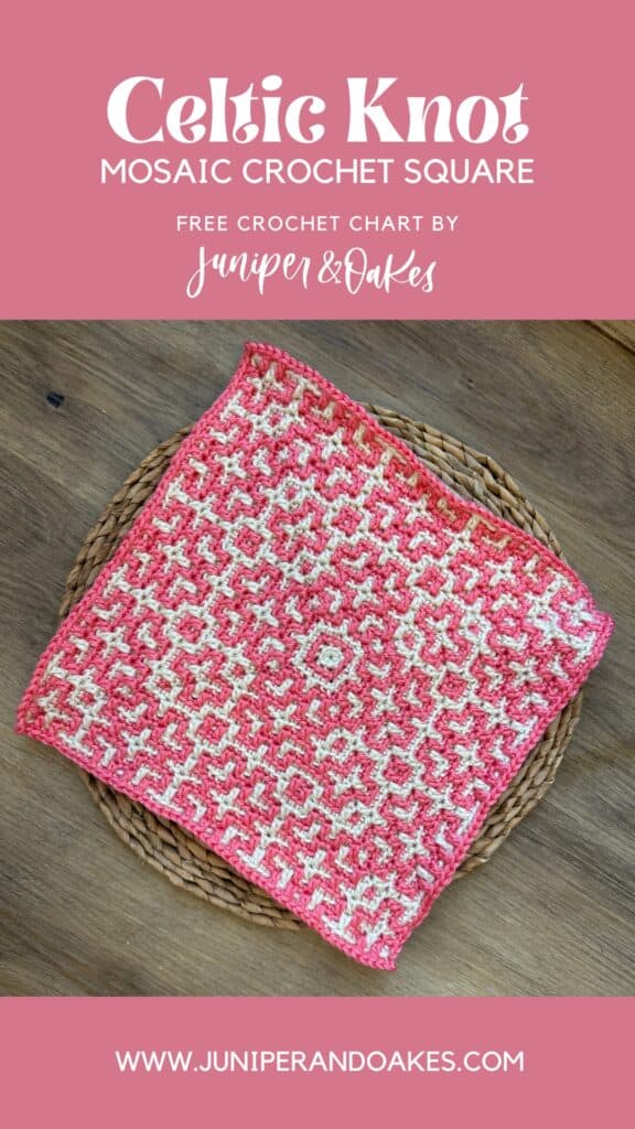 Close-up of a pink and white Celtic knot mosaic crochet square on a wooden surface.