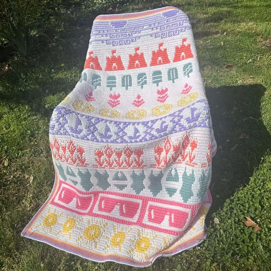 Beautiful mosaic blanket with colorful patterns and summer motifs. Perfect for outdoor decor and sho.