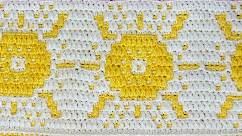Vibrant yellow and white crochet sunshine mosaic pattern for summer blankets.