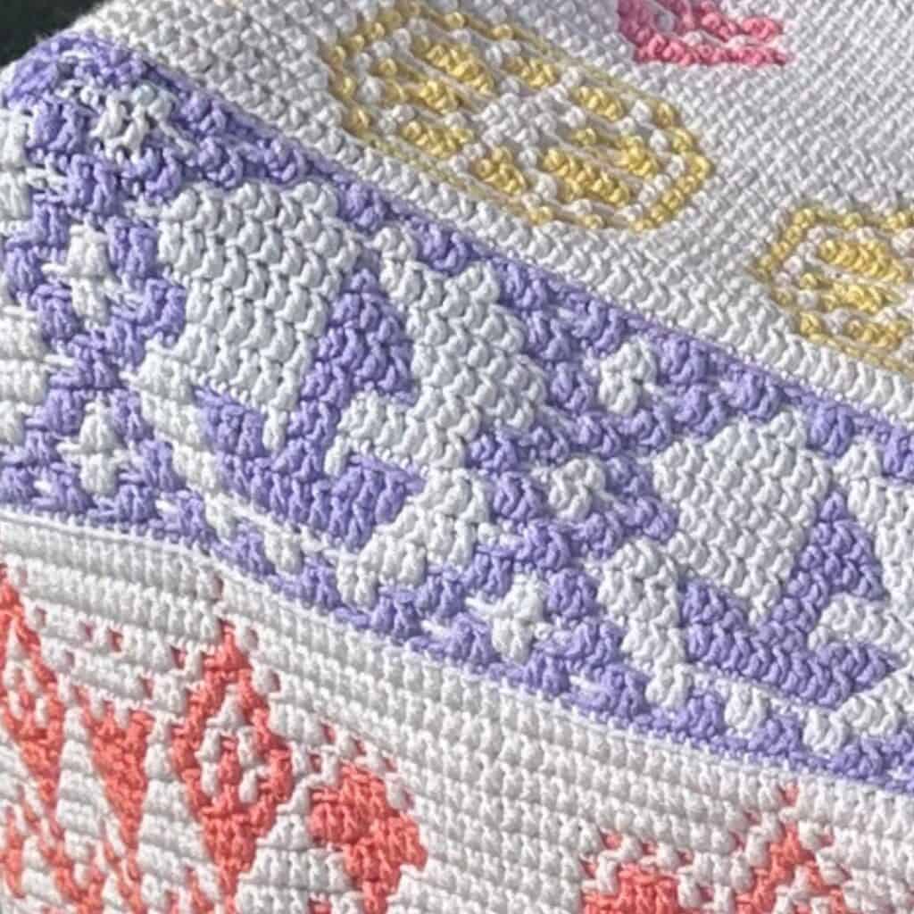 Detailed mosaic crochet sailboat pattern with vibrant colors and intricate design. Perfect for croch.