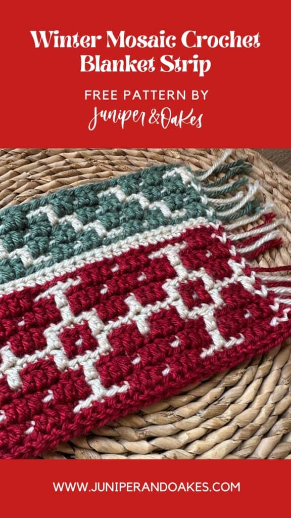 Close-up of a festive winter mosaic crochet blanket with red, white, and green yarns.