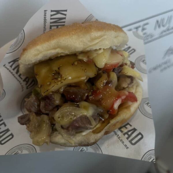 Delicious donut sandwich filled with meat, cheese, and vegetables, served at Knead Donuts in Phillip.