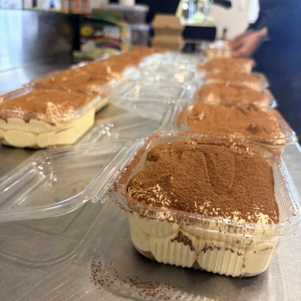 Tiramisu dessert pots with cocoa powder topping from Knead Donuts.