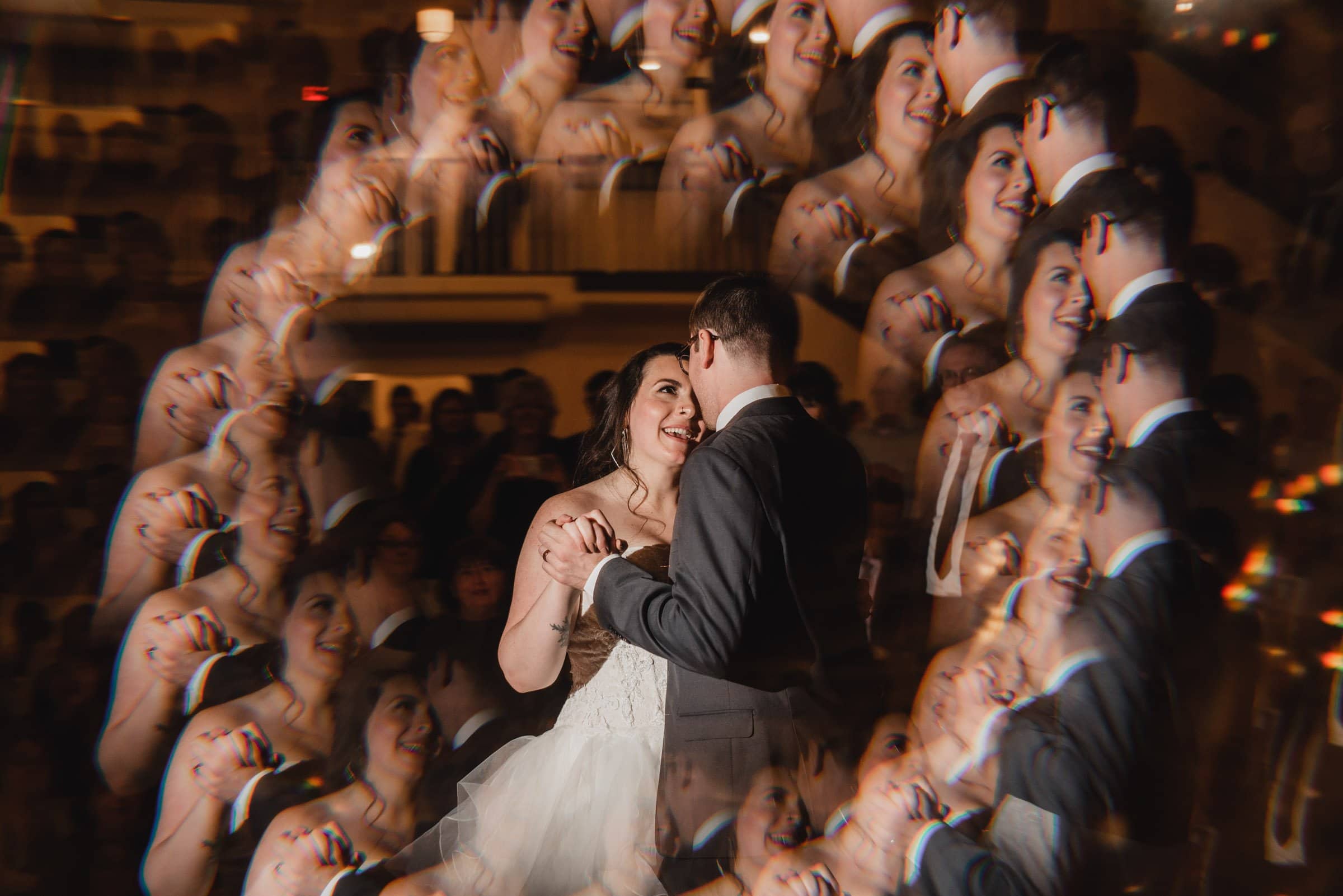 The bride and groom dance as a kaleidoscope effect creates multiple reflections around them, capturing the magic of their special day. These stunning wedding photos at The Evergreen encapsulate the joy and vibrant celebration with every spin and twirl.