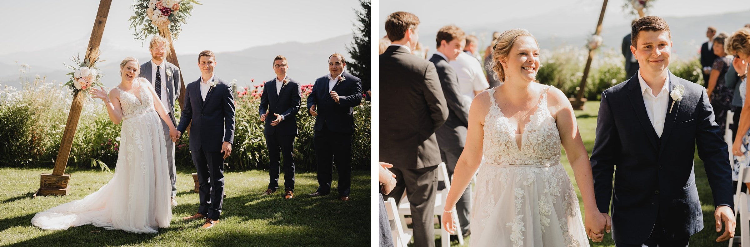 The bride in a white dress and groom in a suit share a joyful moment at their outdoor wedding ceremony at Gorge Crest Vineyards, surrounded by smiling guests.
