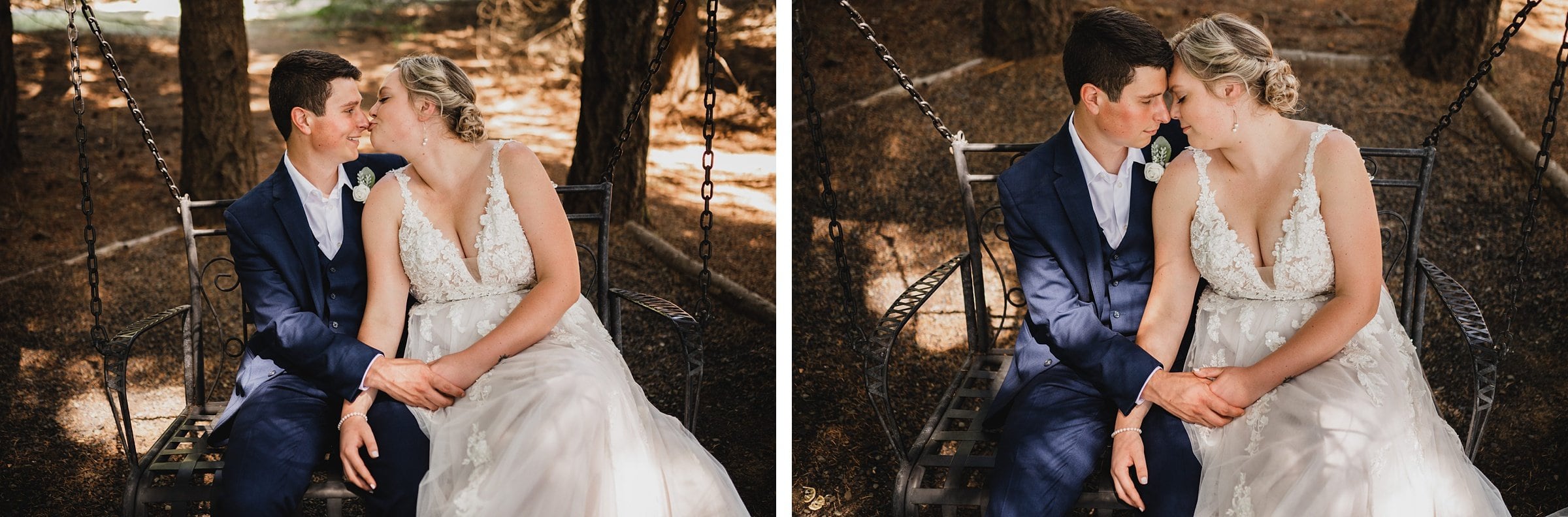 In a serene wooded area, a couple in wedding attire sits on a bench, sharing a tender kiss and holding hands affectionately.