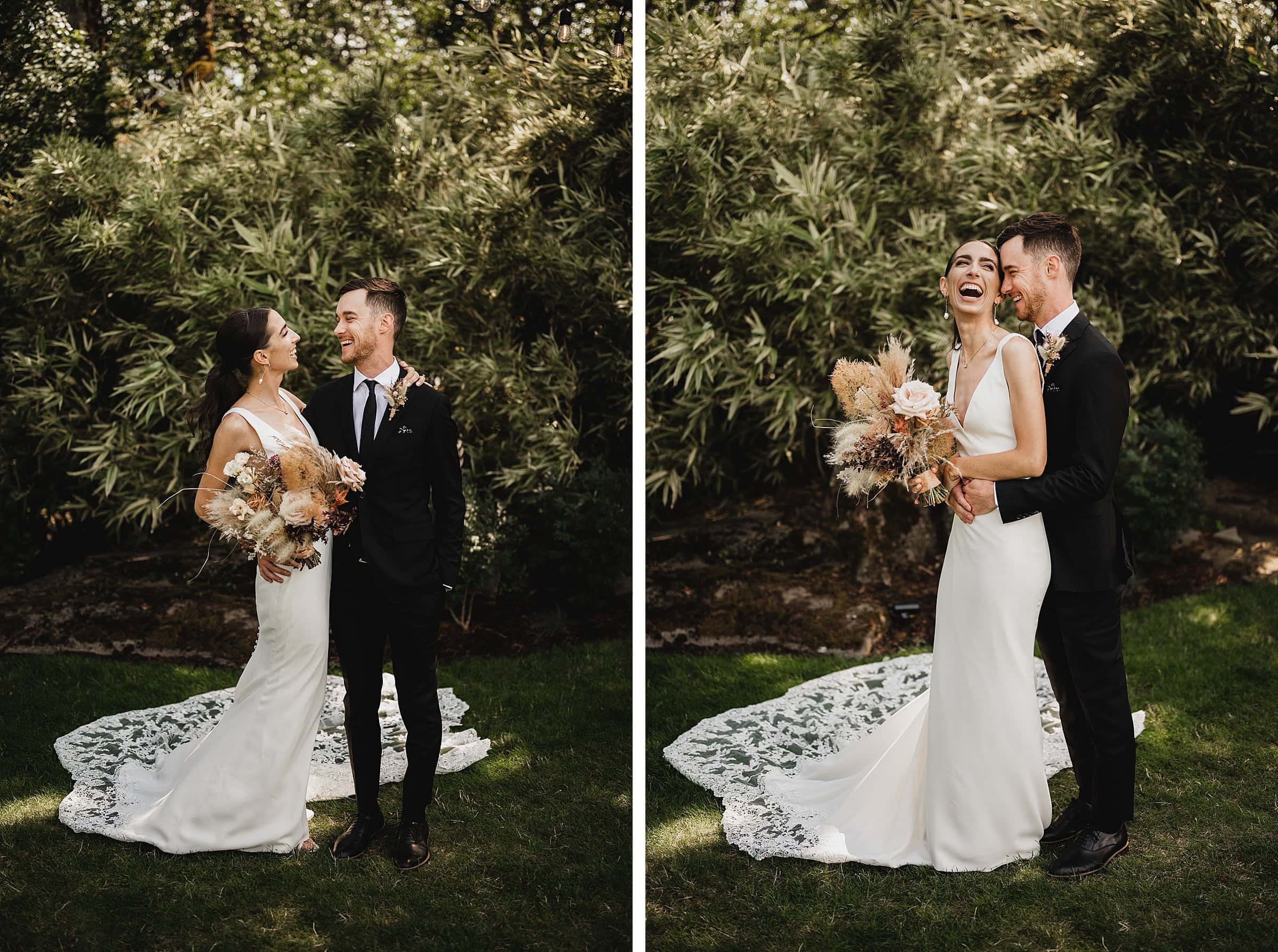 A bride and groom stand smiling in a garden at The Griffin House, the bride holding a bouquet with rustic flowers.