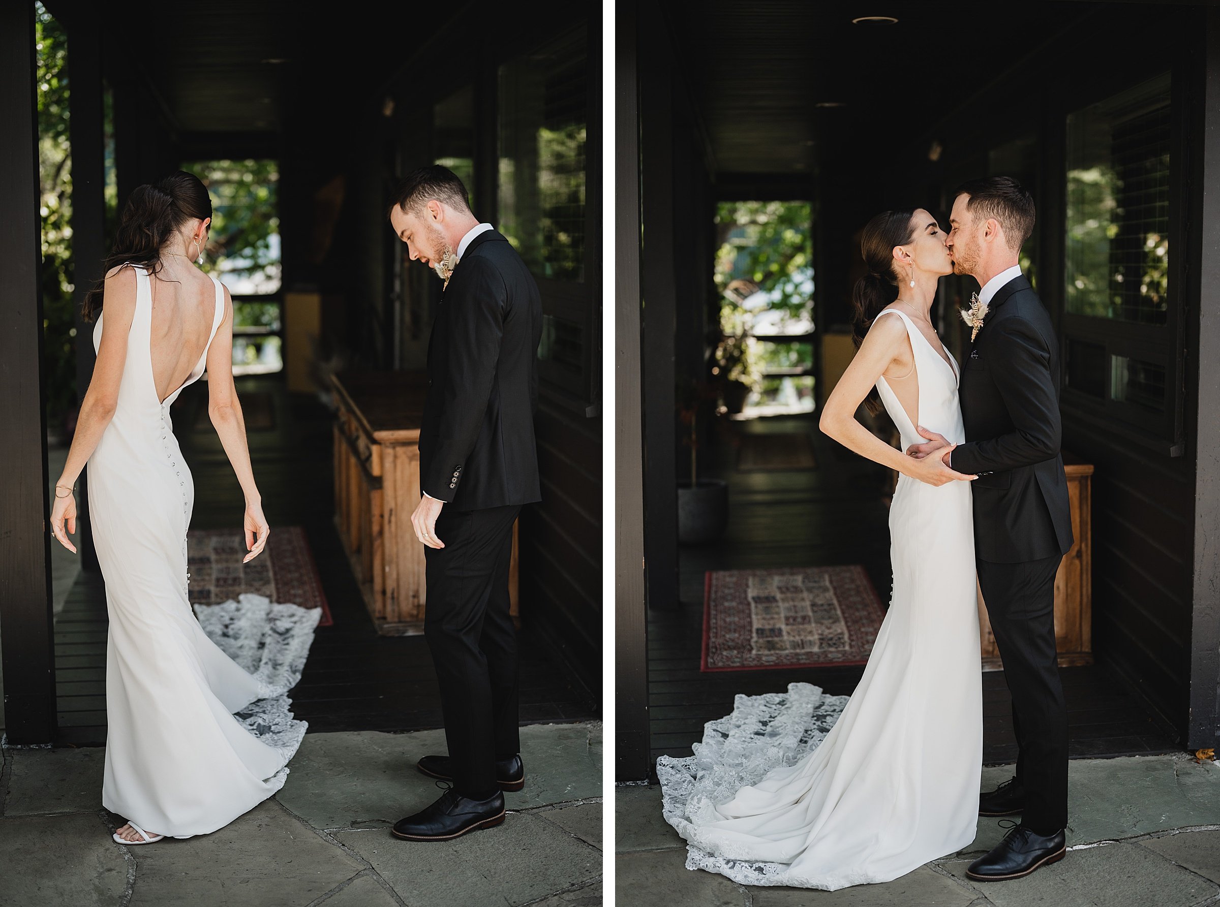 The bride and groom, in formal attire, embrace and kiss in a hallway with a wooden bench and greenery. Their wedding photos at The Griffin House capture the moment beautifully.