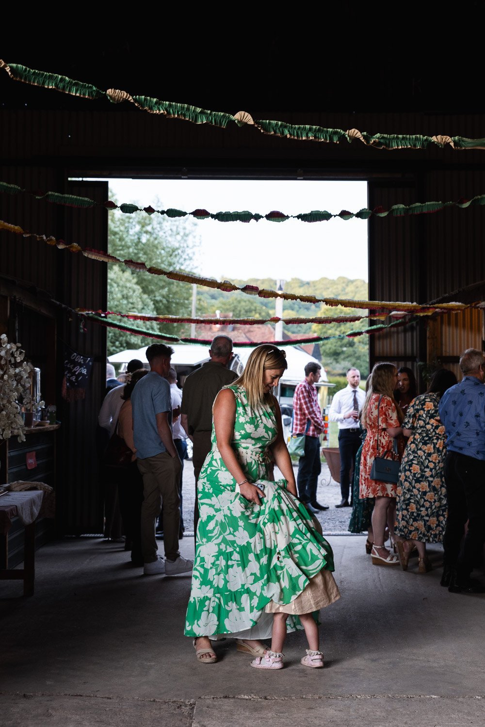 Photography of a yellow DIY wedding in a barn by London photographer Lauren Squire