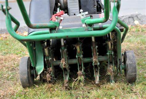 Lawn aerator machine used for soil aeration and lawn health enhancement.