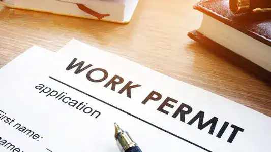 Residence permit Romania after job loss – expat reviewing documents after employment termination in Bucharest