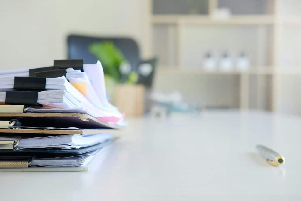 Documents and paperwork on an office desk representing company formation and business bureaucracy in Romania