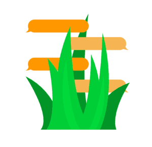 Green grass with orange and beige directional signs for outdoor navigation.