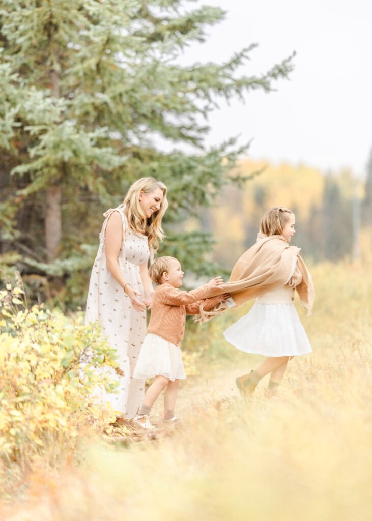 fall family photos taken in Edmonton for mom and her 2 girls