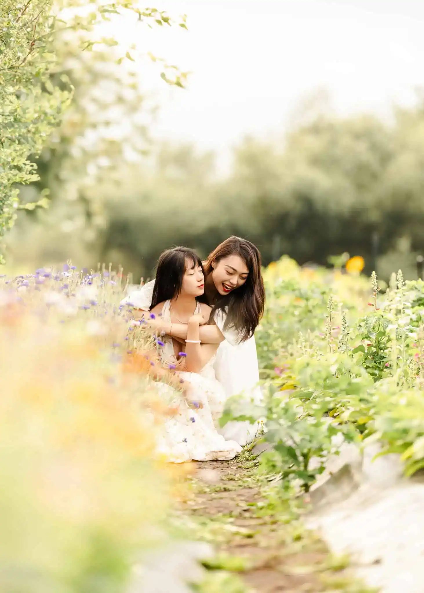 Family hugging each other in Edmonton flower garden for famiy photoshoot