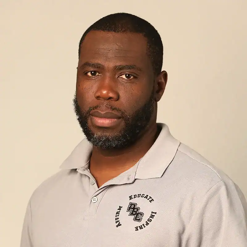 Portrait of a man with a beard wearing a gray polo shirt with Lou Groza Award logo.