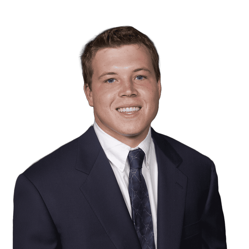 Young man in suit smiling, representing Lou Groza Award candidate.