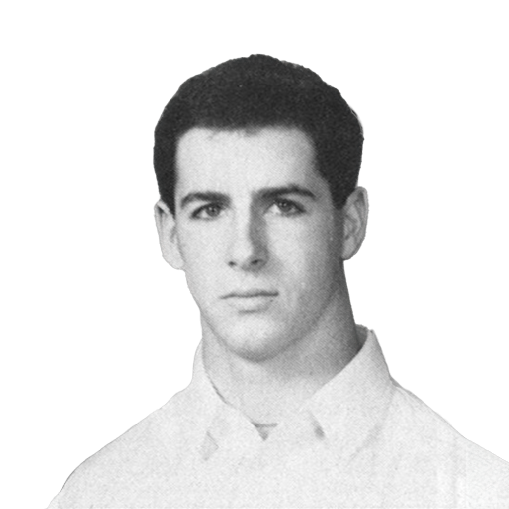 Black and white portrait of a young male football player in a collared shirt.