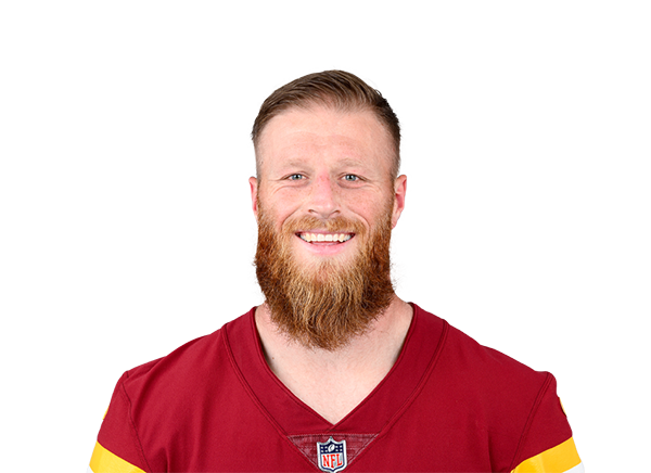 Lou Groza Award-winning football kicker in team jersey smiling.
