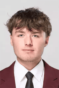 Young man in formal suit and tie, professional headshot for Lou Groza Award.