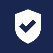 Shield with checkmark representing cybersecurity protection at Mach Technologies.