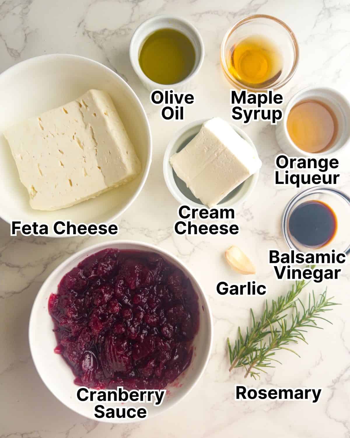 Cranberry sauce, feta cheese, cream cheese, rosemary, maple syrup, and more ingredients for whipped feta cranberry dip.