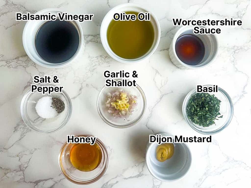 Ingredients in small bowls to make balsamic basil vinaigrette.