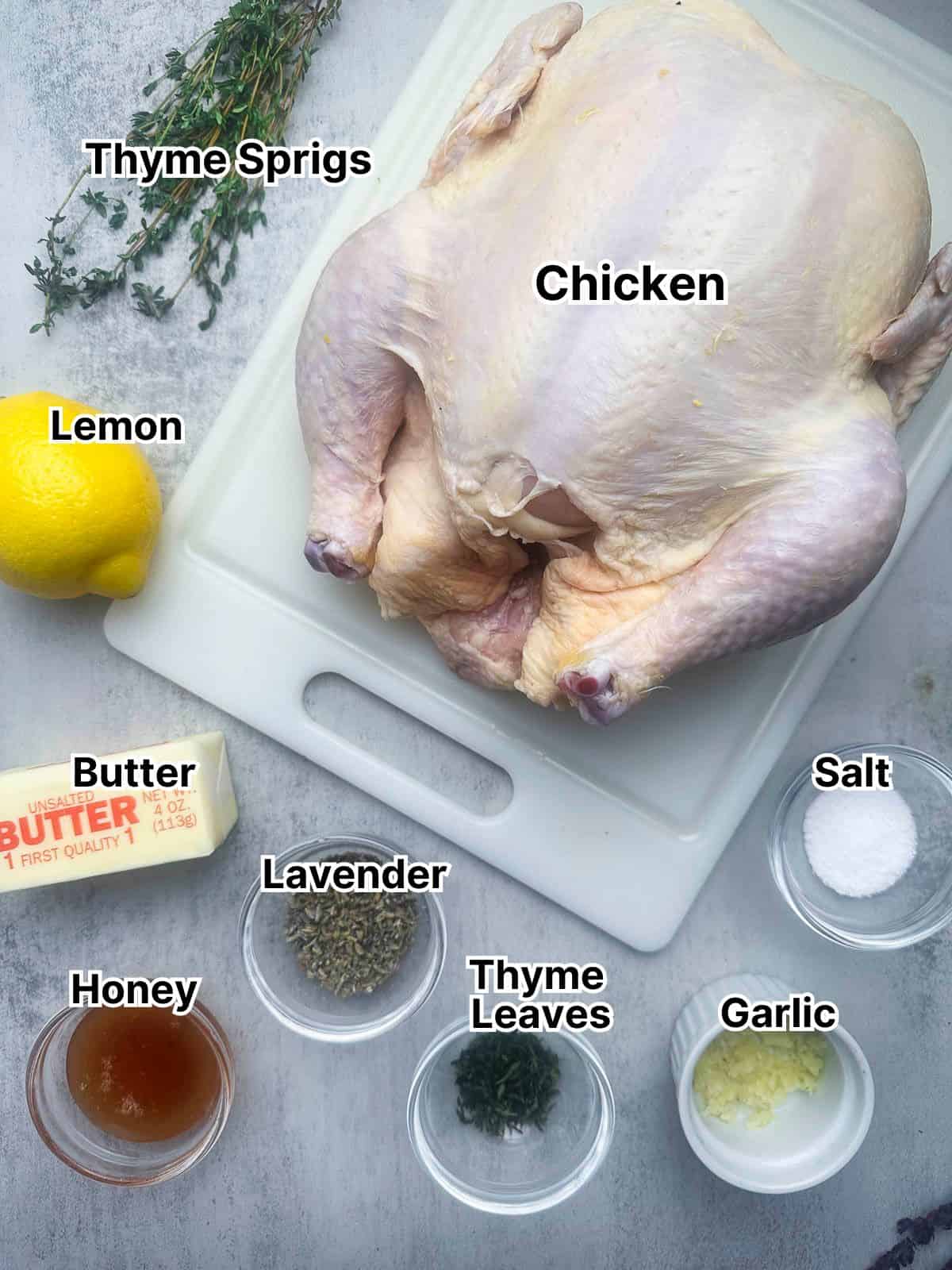 Ingredients for lavender herb butter chicken spread out on a countertop.