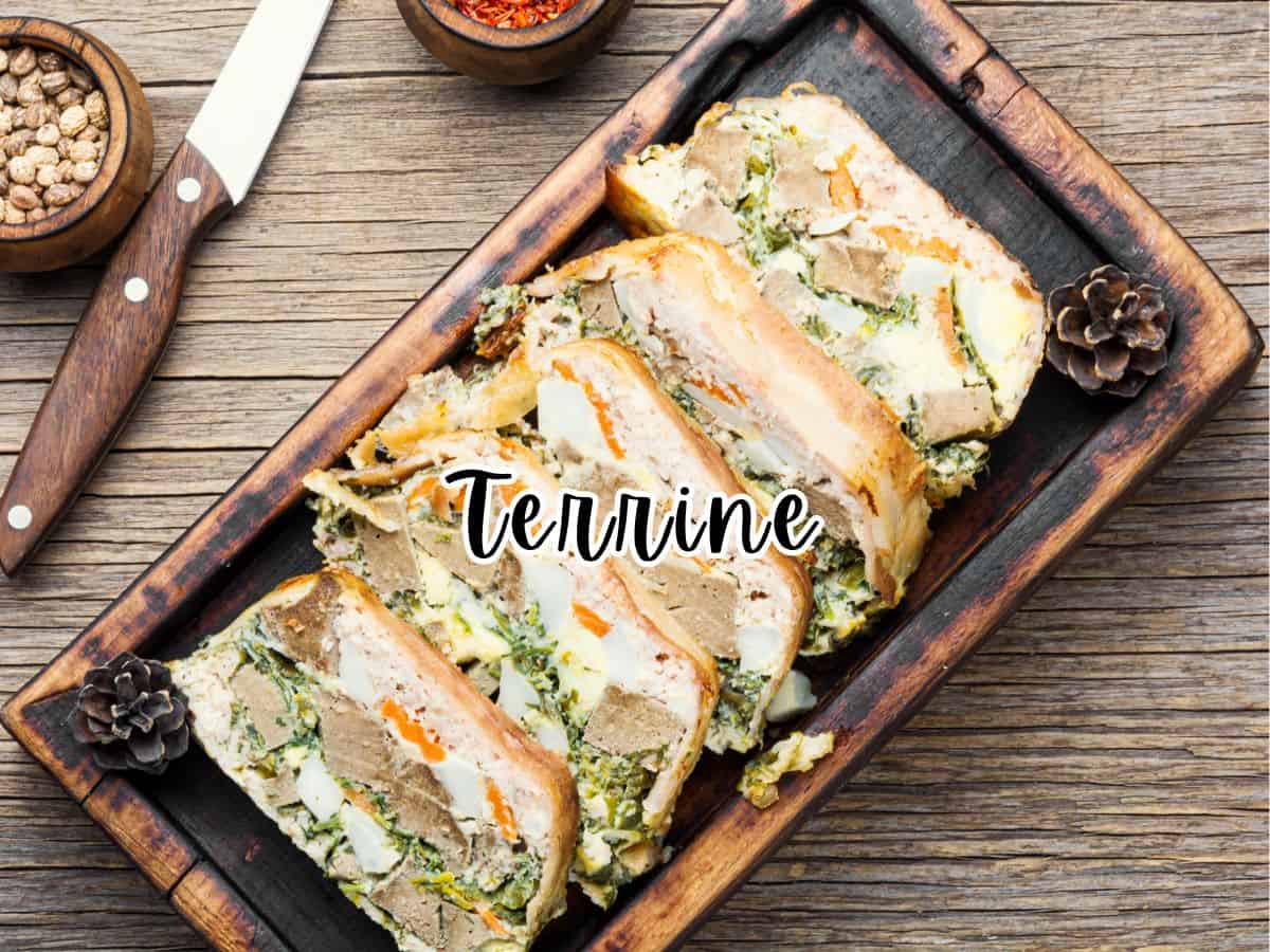 Sliced French terrines on a wooden serving platter.